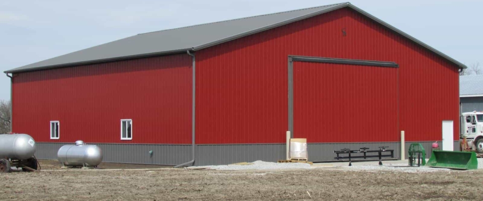 large red insulated ag building post frame