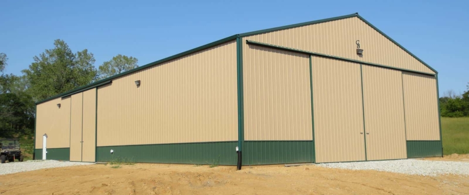 gold and green machine shed storage building