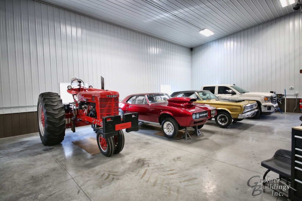 interior of pole barn with storage for car and tractor collection