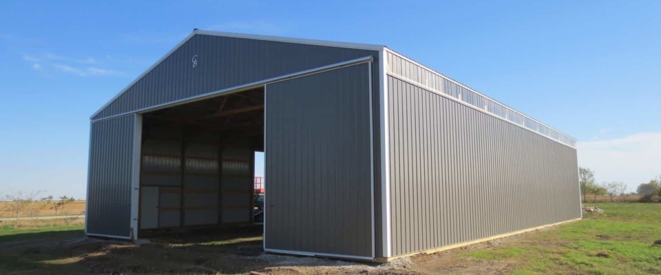 large gray pole building machine shed on farm