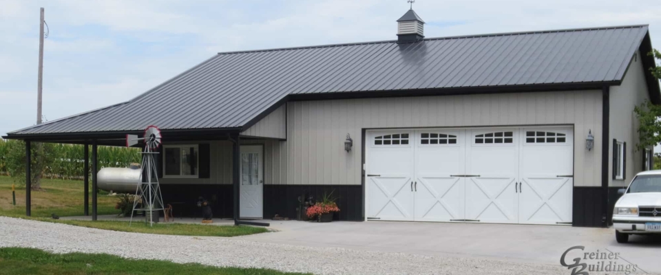 tan pole barn garage with white door