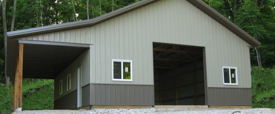 gray and brown pole barn garage new windows