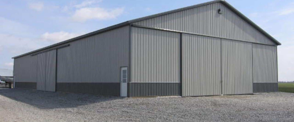 large gray machine shed building
