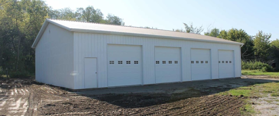 large white machine shed 4 overhead doors