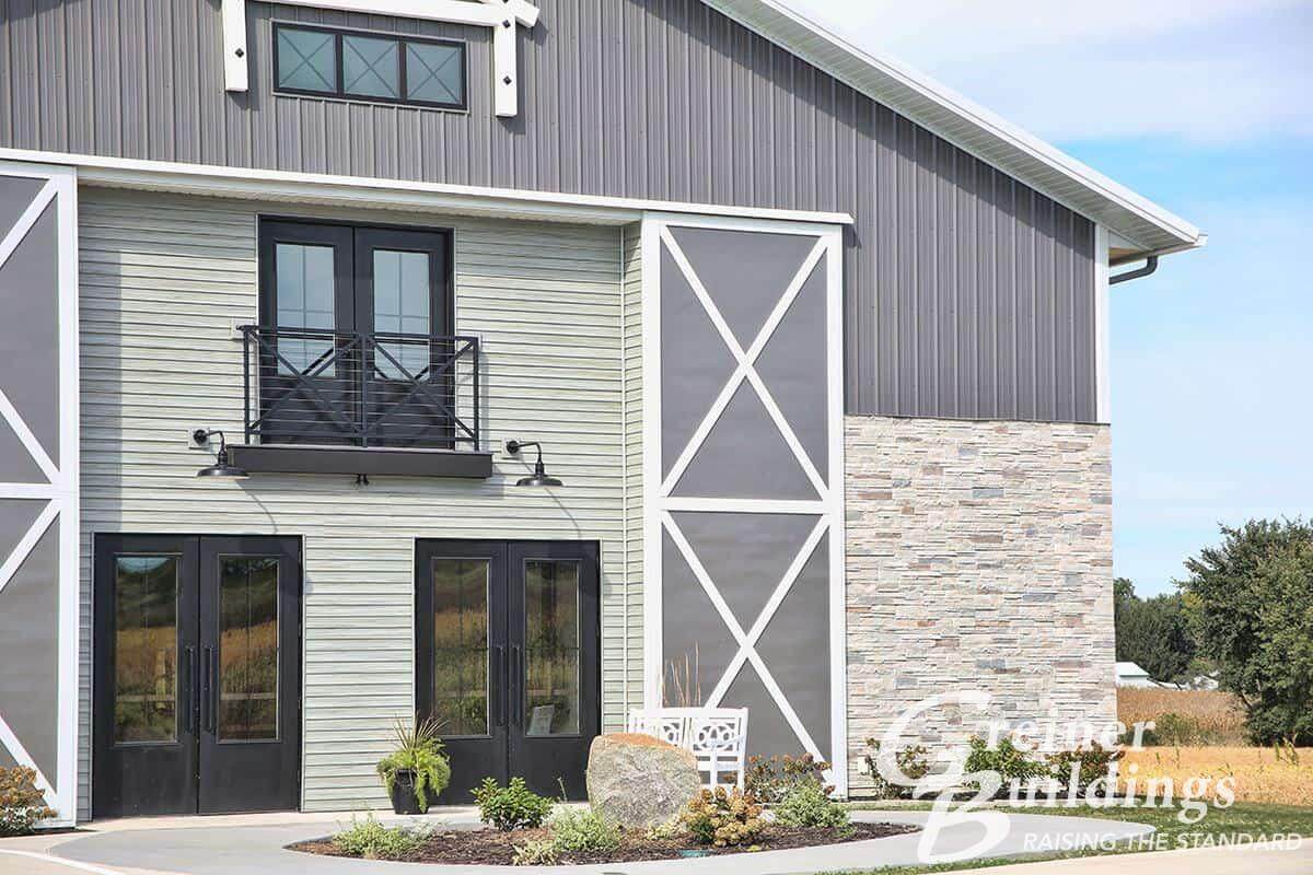 Fairfield Iowa Post Frame Buildings by Greiner Buildings Gray and stone wainscoting pole barn