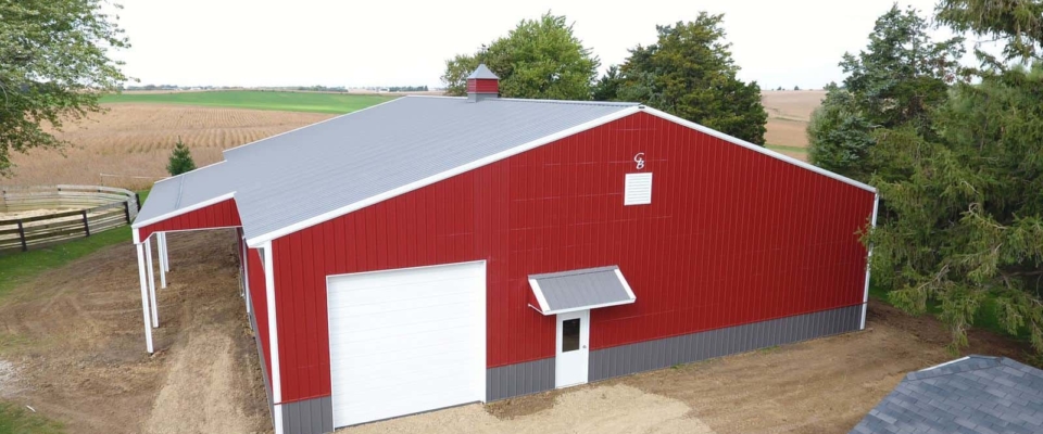 red post frame building horse barn