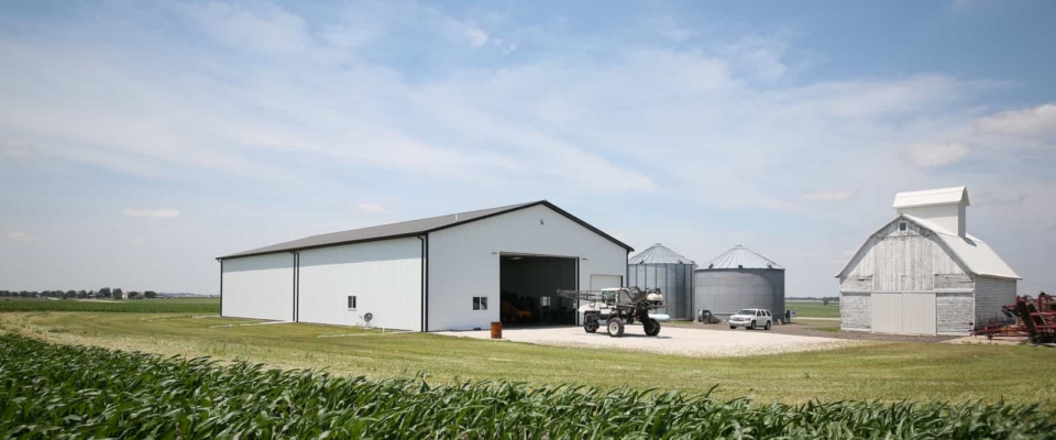 white pole barn shop on farm
