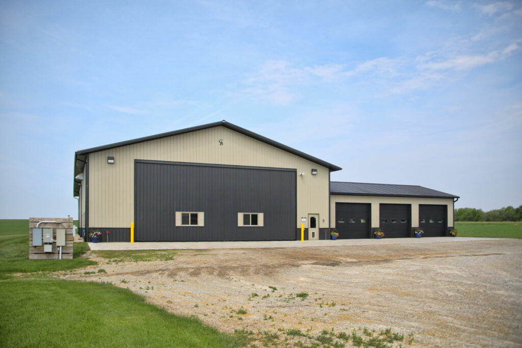 tan and brown ag pole building farm shop ideas Greiner Buildings Rossiter-lined-insulated-shop-exterior-3