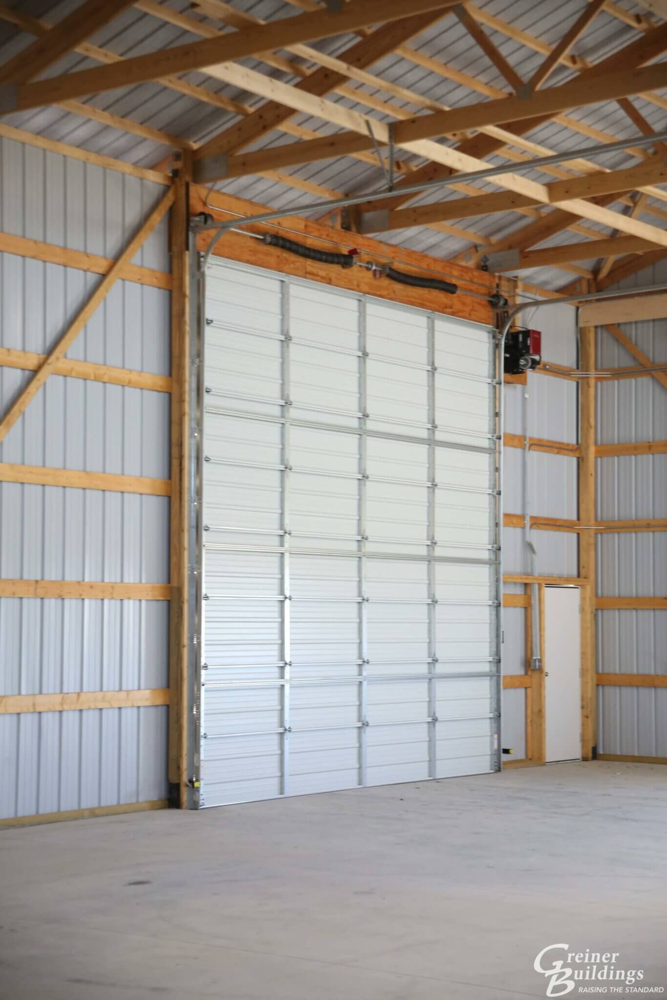 large overhead door inside pole building garage