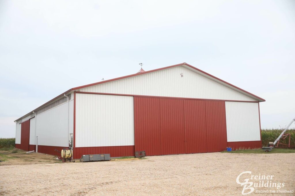 red and white large post frame ag building