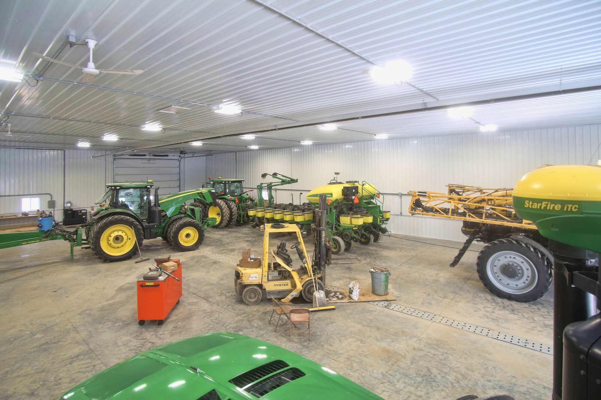 inside a greiner lined shop with farm equipment