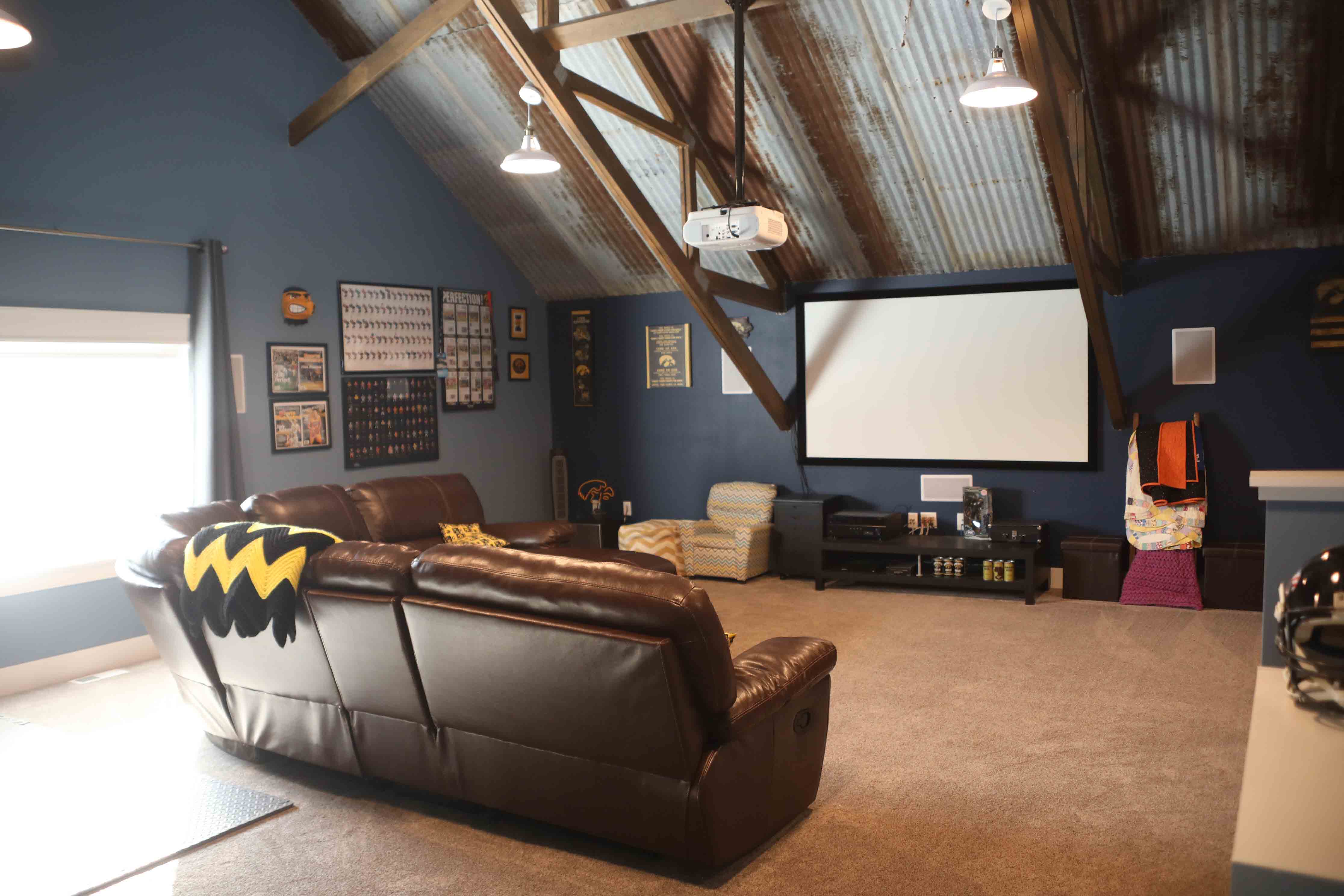 couch and projector inside pole barn house