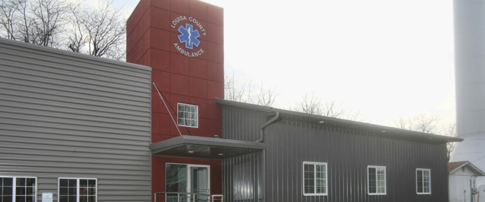 gray custom pole building for county ambulance station